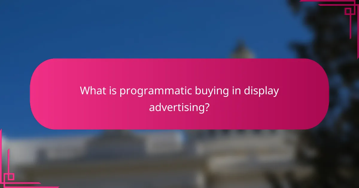 What is programmatic buying in display advertising?